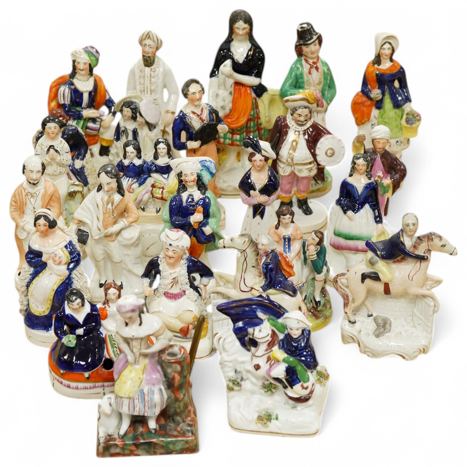 Twenty five various Staffordshire figures, tallest 23.5cm. Condition - varies